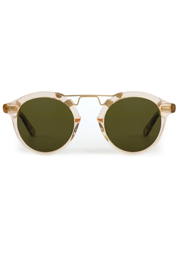 Round sunglasses with gold frame and green lenses on a white background