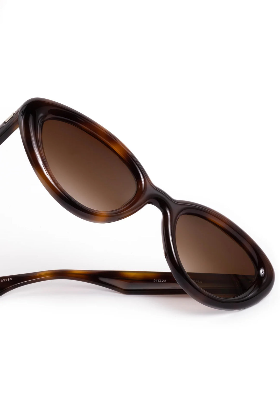 Sunglasses with tortoiseshell frame and brown lenses on a white background