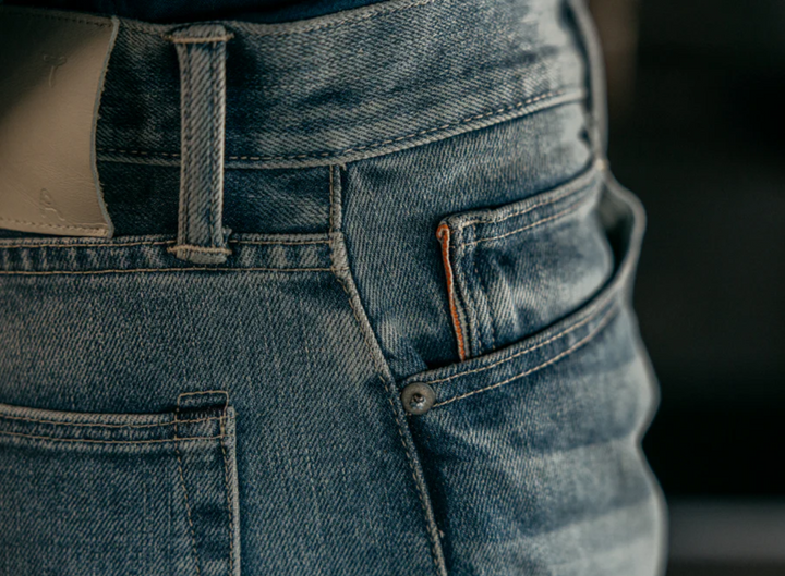 Close-up of blue jeans with a blurred background