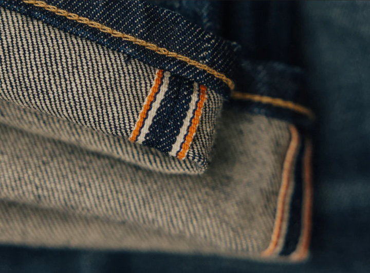 Close-up of denim fabric with stitching details