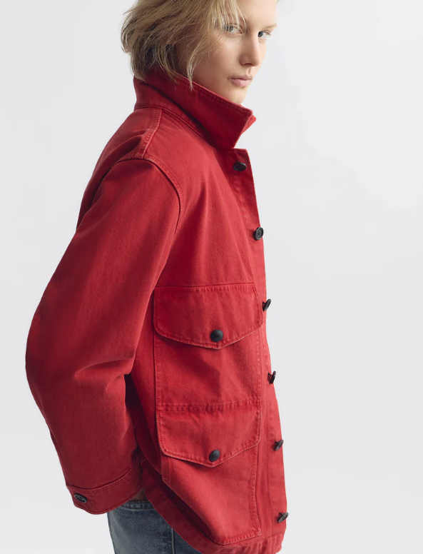 Person wearing a red jacket on a white background
