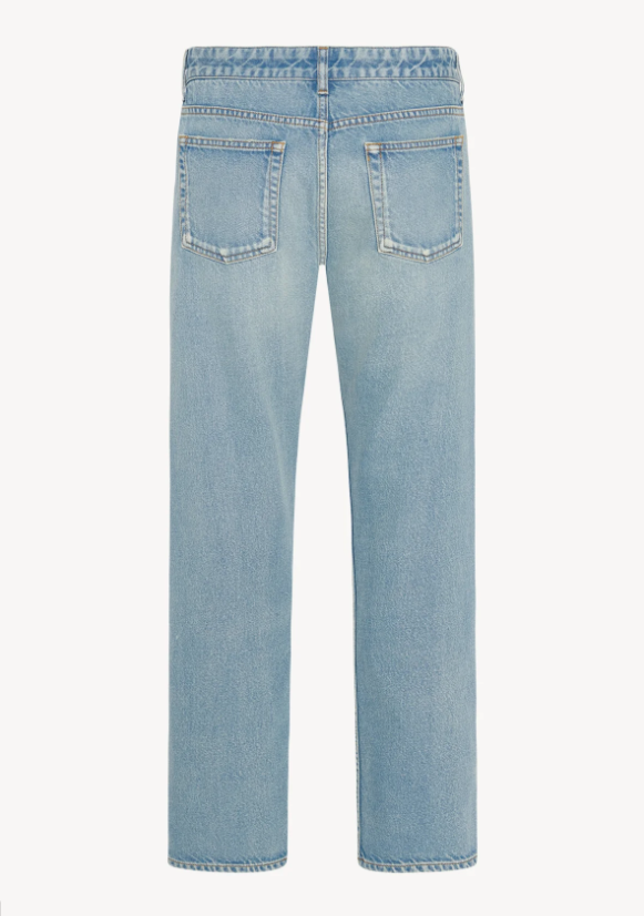 Back view of light blue jeans on a white background