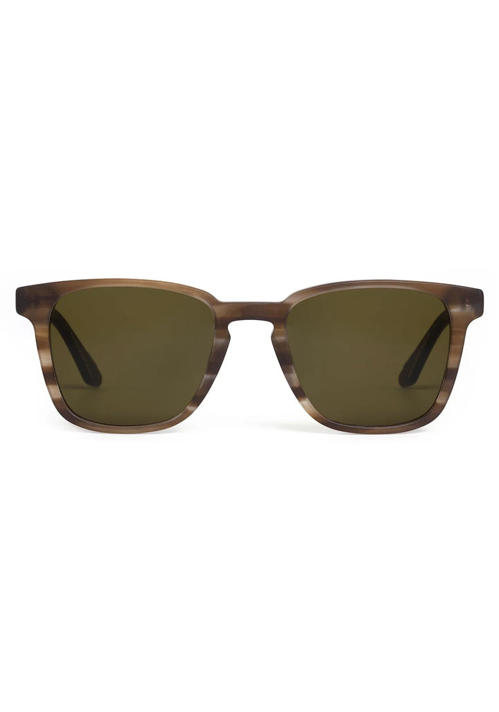 Sunglasses with brown frame and green lenses on a white background