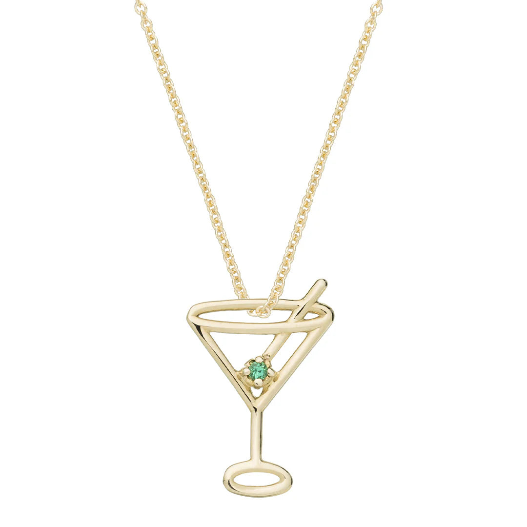 Gold martini glass pendant necklace with a green gemstone on a white background