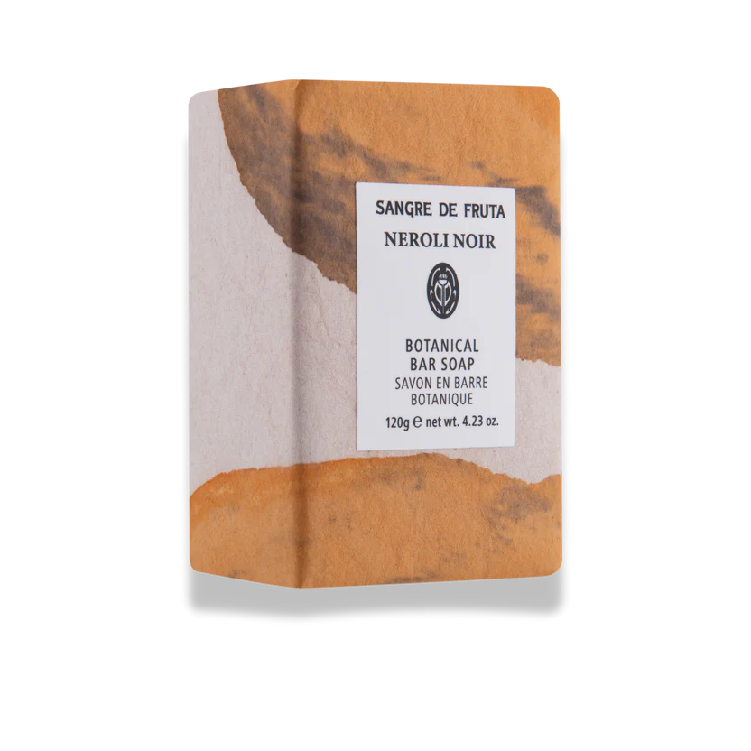 Bar of soap with a marbled design and a label on a white background