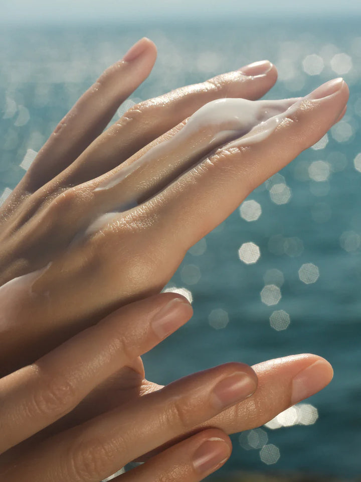 Close-up of hands with a blurred natural background