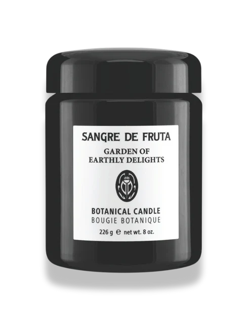 Black candle jar with 'Sangre de Fruta' label on a white background