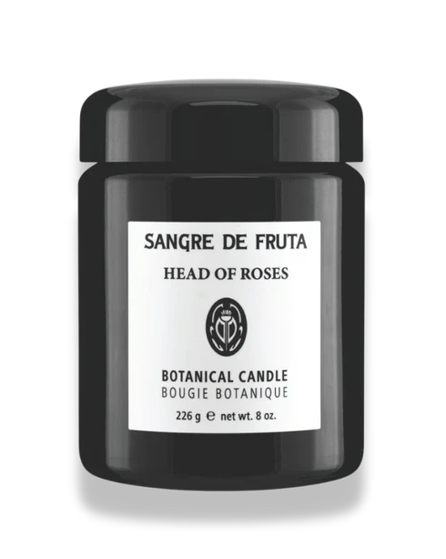 Black candle jar with 'Sangre de Fruta Head of Roses' label on a white background