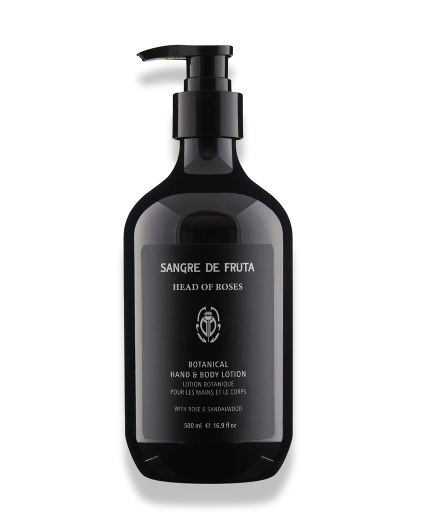 Black lotion bottle with pump labeled 'Sangre de Fruta' on a white background