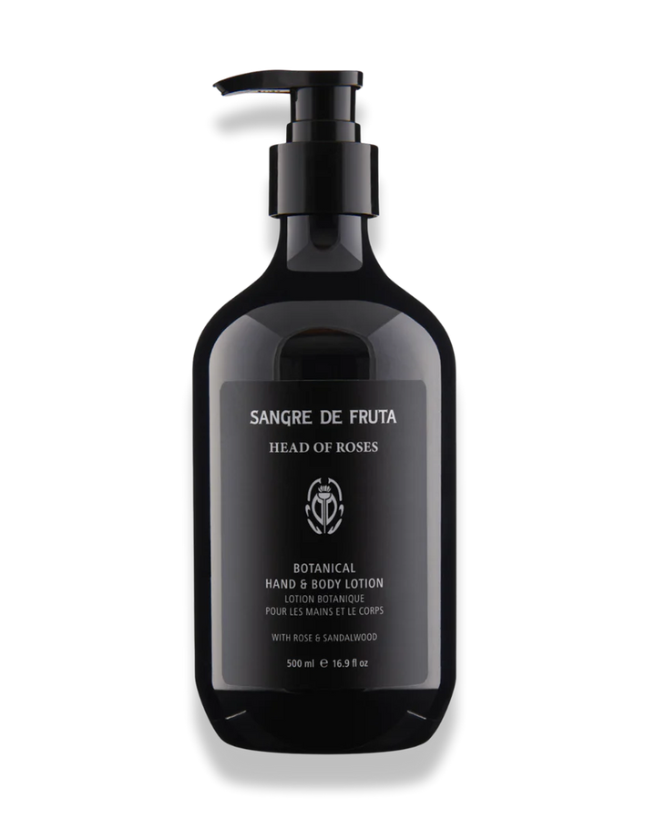 Black lotion bottle with pump labeled 'Sangre de Fruta' on a white background