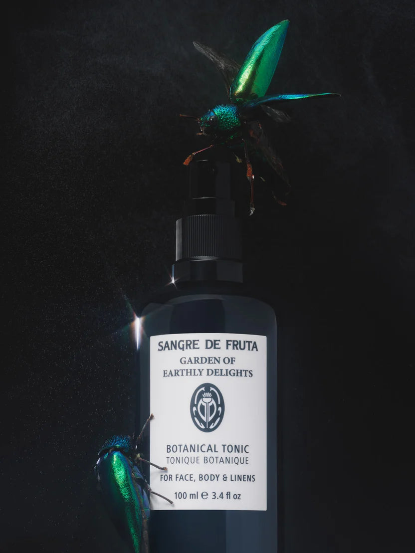 Bottle of Sangre de Fruta Botanical Tonic with a dark background