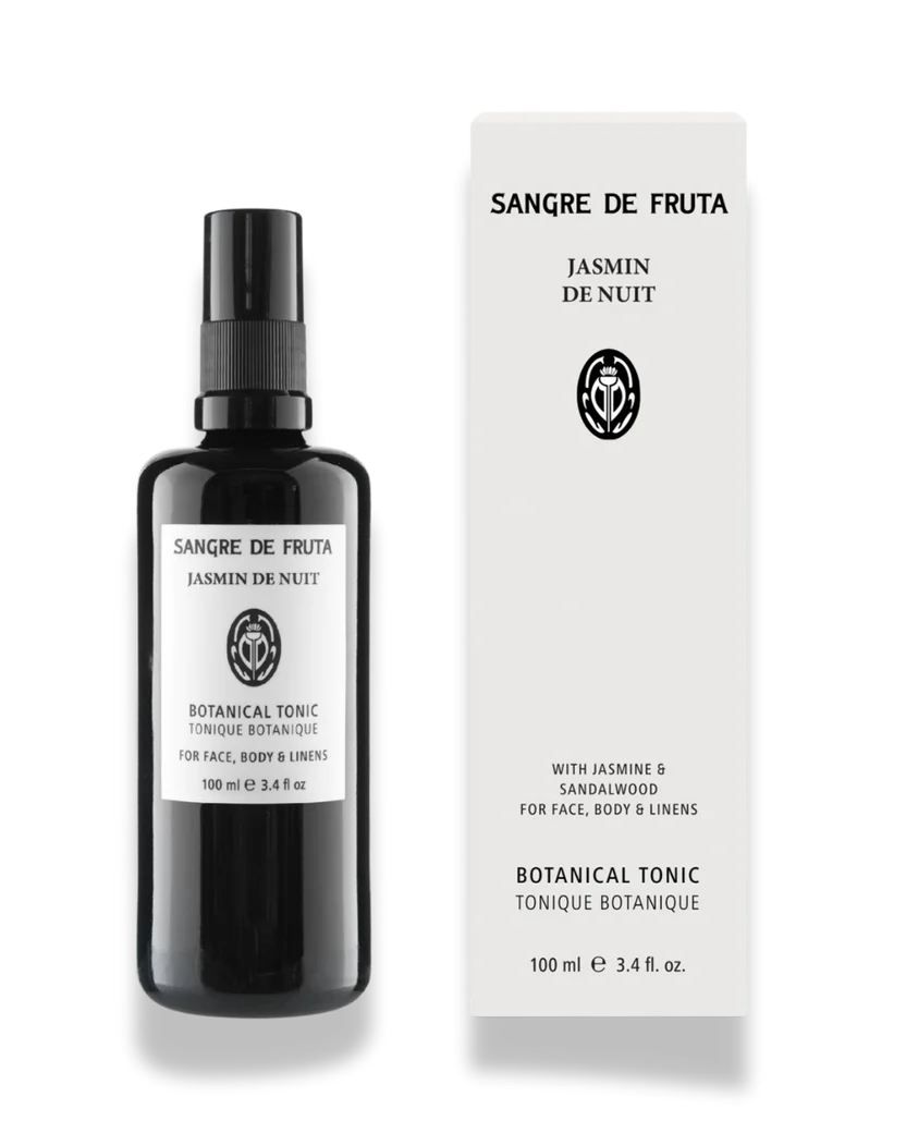Black bottle and white box of Sangre de Fruta Jasmin de Nuit botanical tonic on a white background