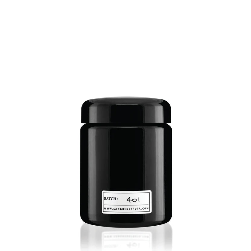 Black container with a white label on a white background