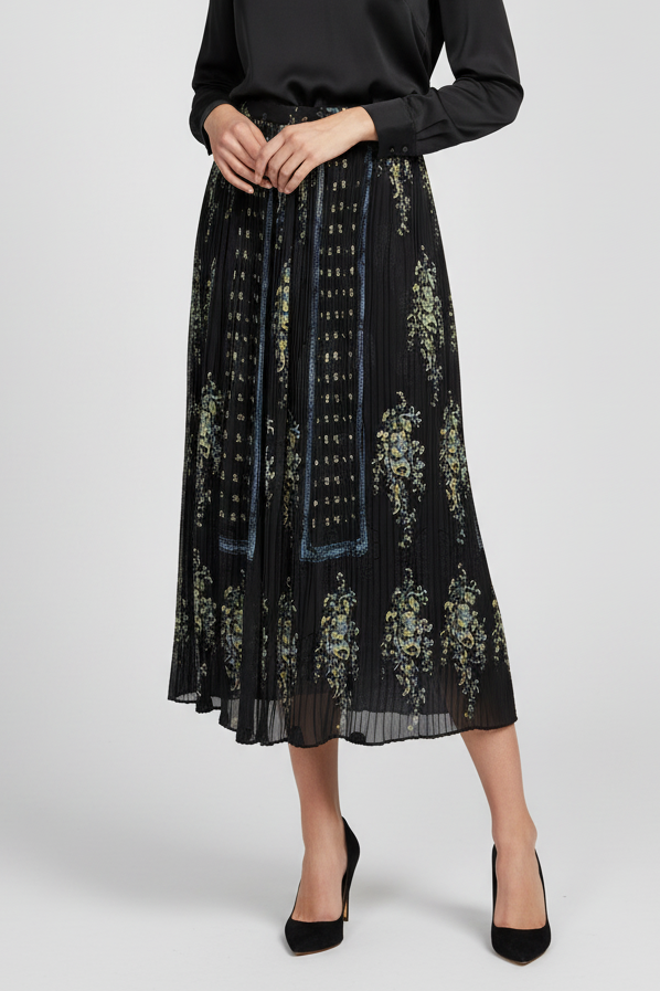 Black floral patterned skirt worn by a person on a white background