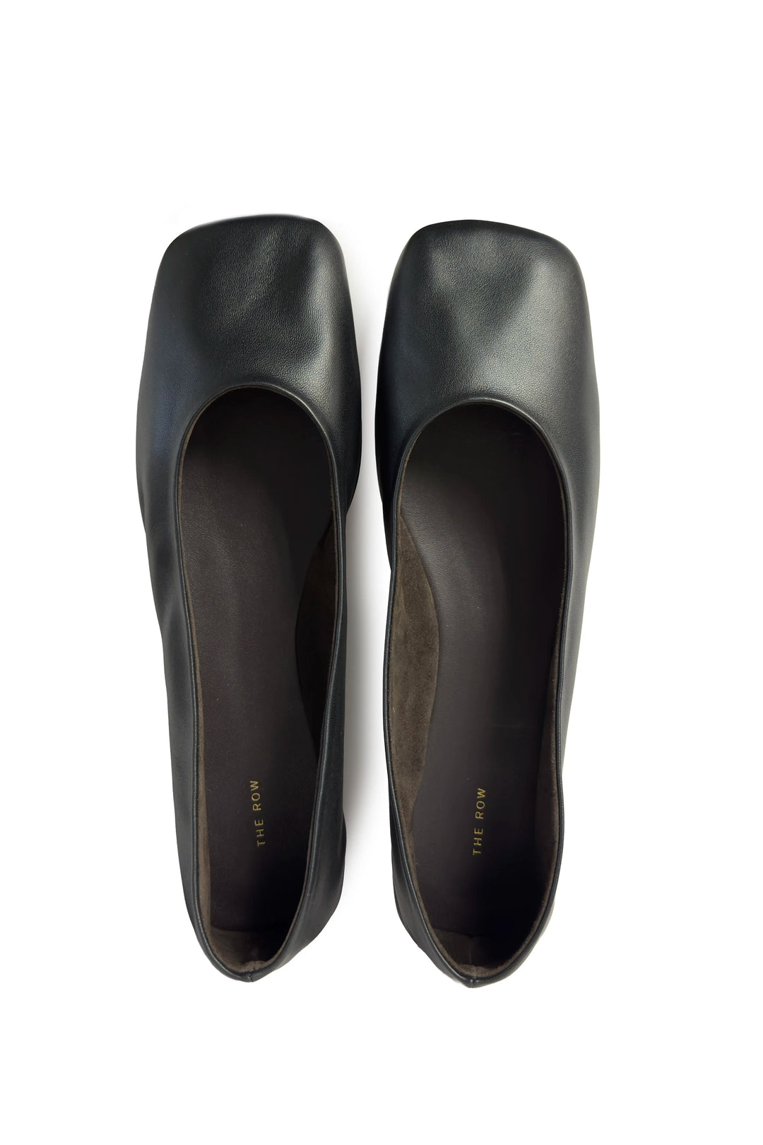 Pair of black high-heeled shoes on a white background