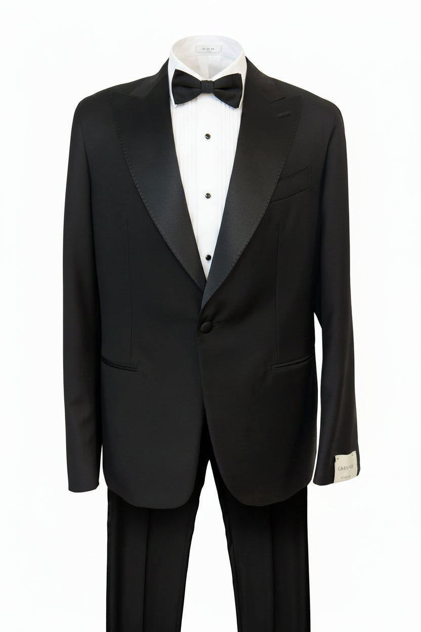 Black tuxedo with a white shirt and black bow tie on a white background