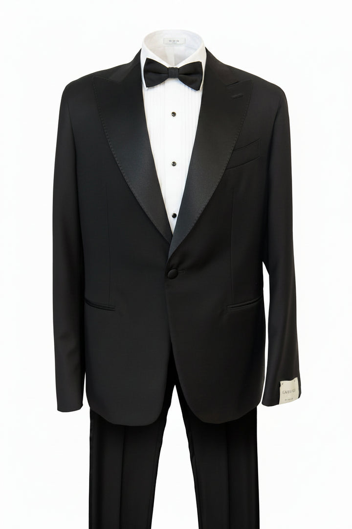 Black tuxedo with a white shirt and black bow tie on a white background