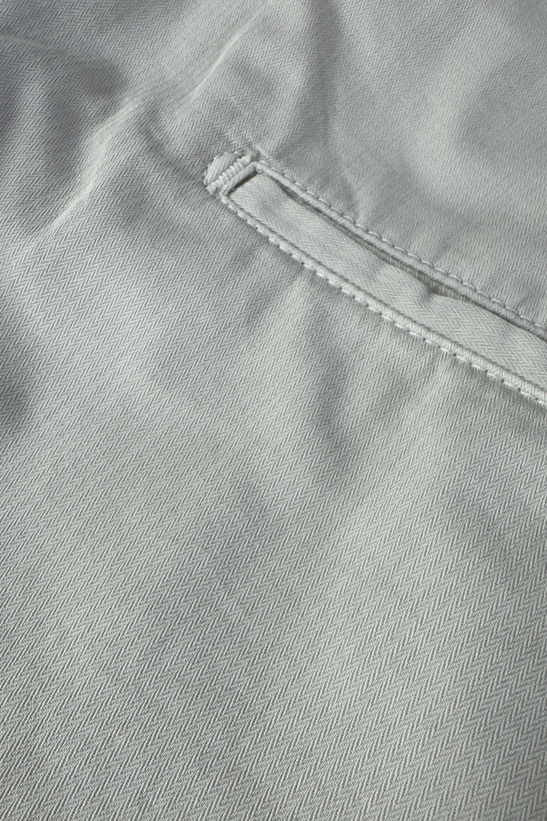 Close-up of gray fabric with stitching detail