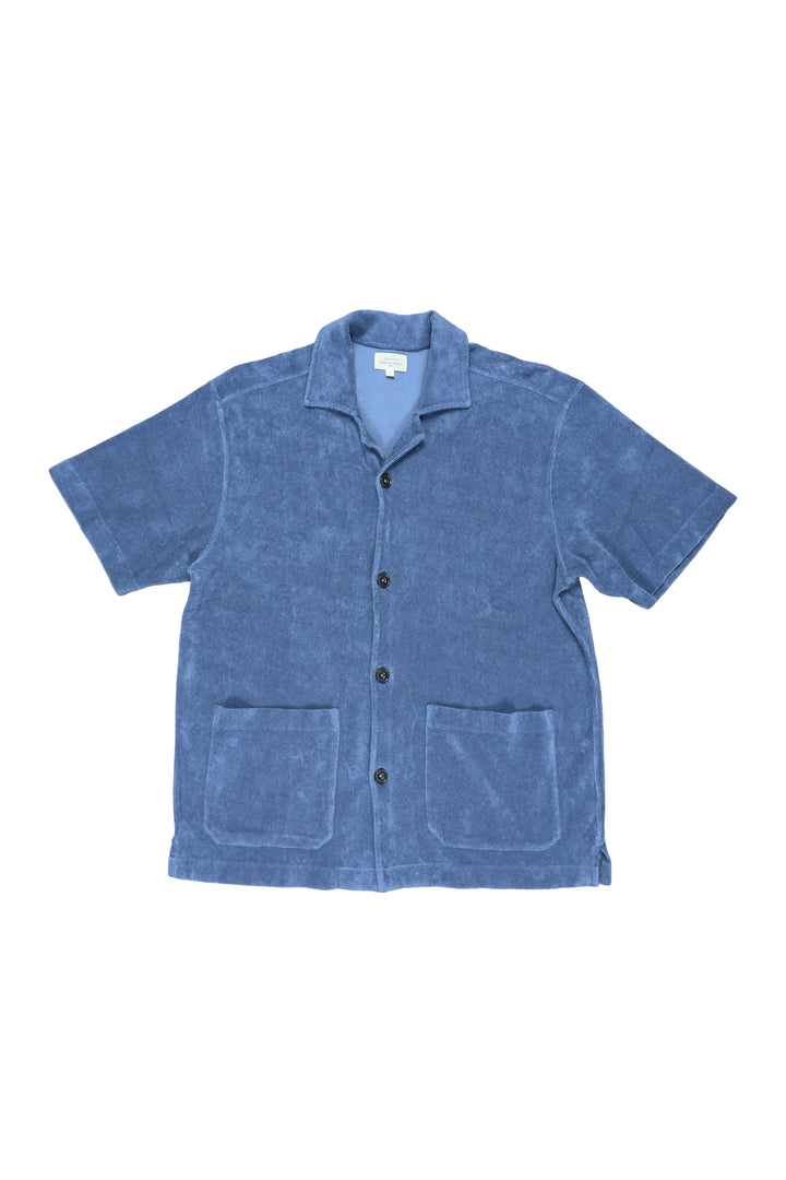 Blue short-sleeve shirt with button details on a white background