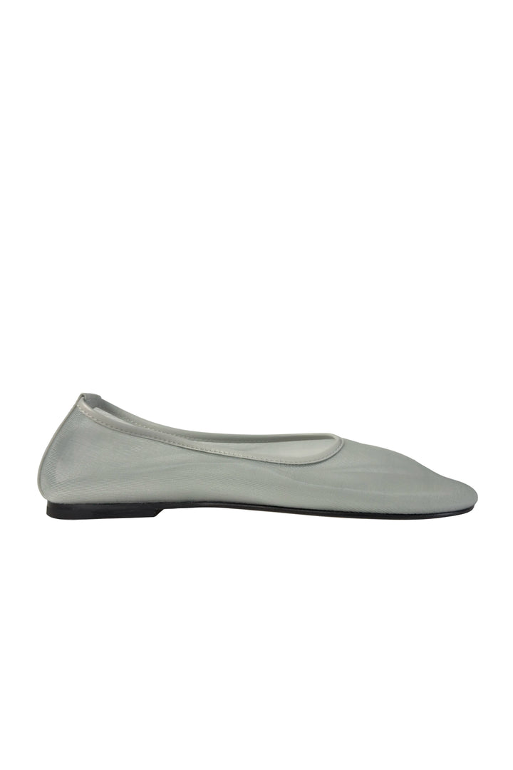 Black sandal sole on a light gray background