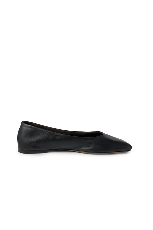 Black flat shoe on a white background