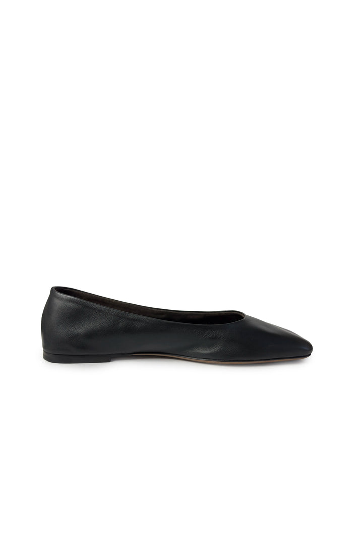Black flat shoe on a white background