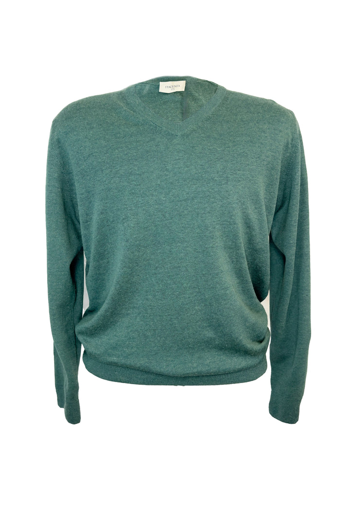 Green sweater on a white background