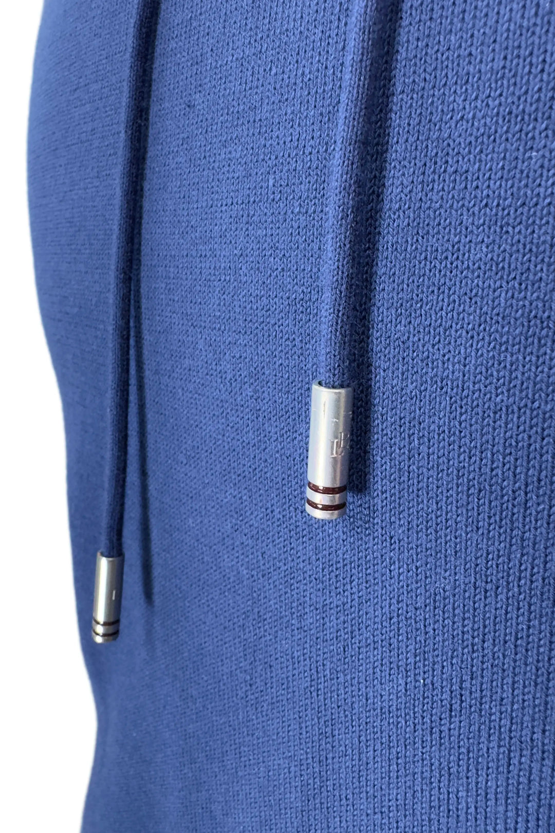 Close-up of a blue hoodie with silver drawstrings on a white background