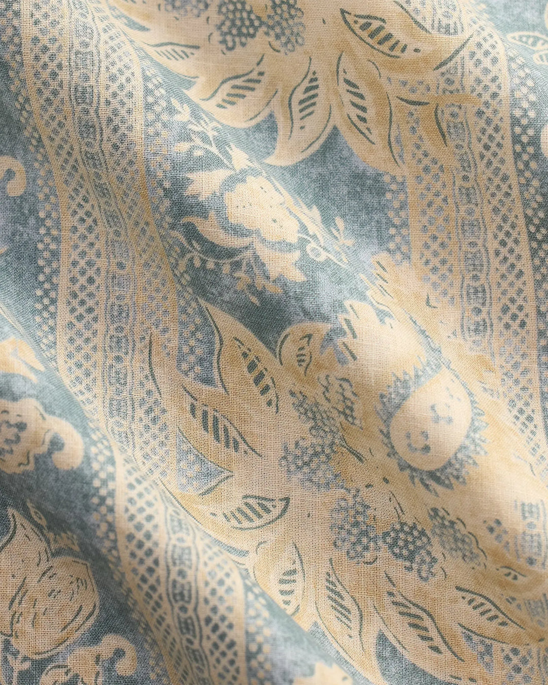 Decorative fabric with intricate gold and blue pattern