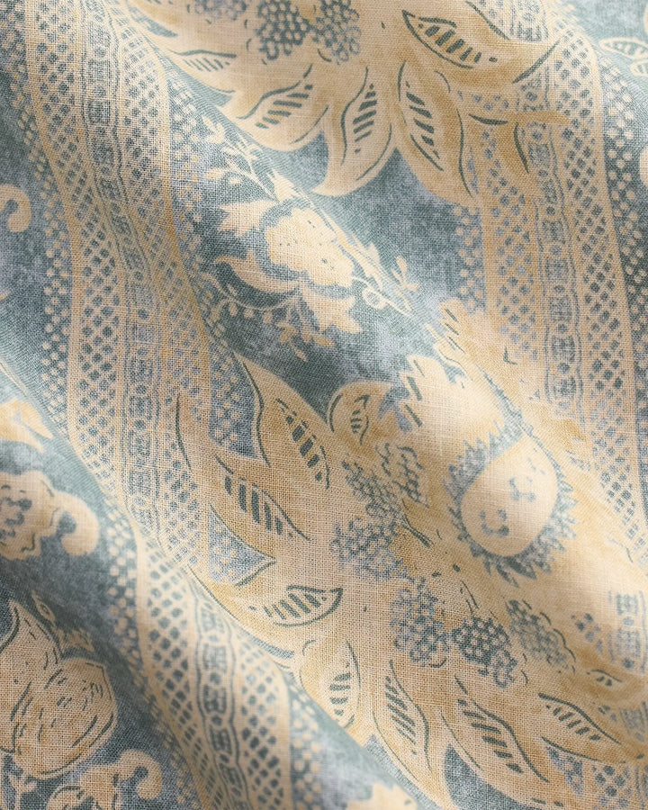 Decorative fabric with intricate gold and blue pattern
