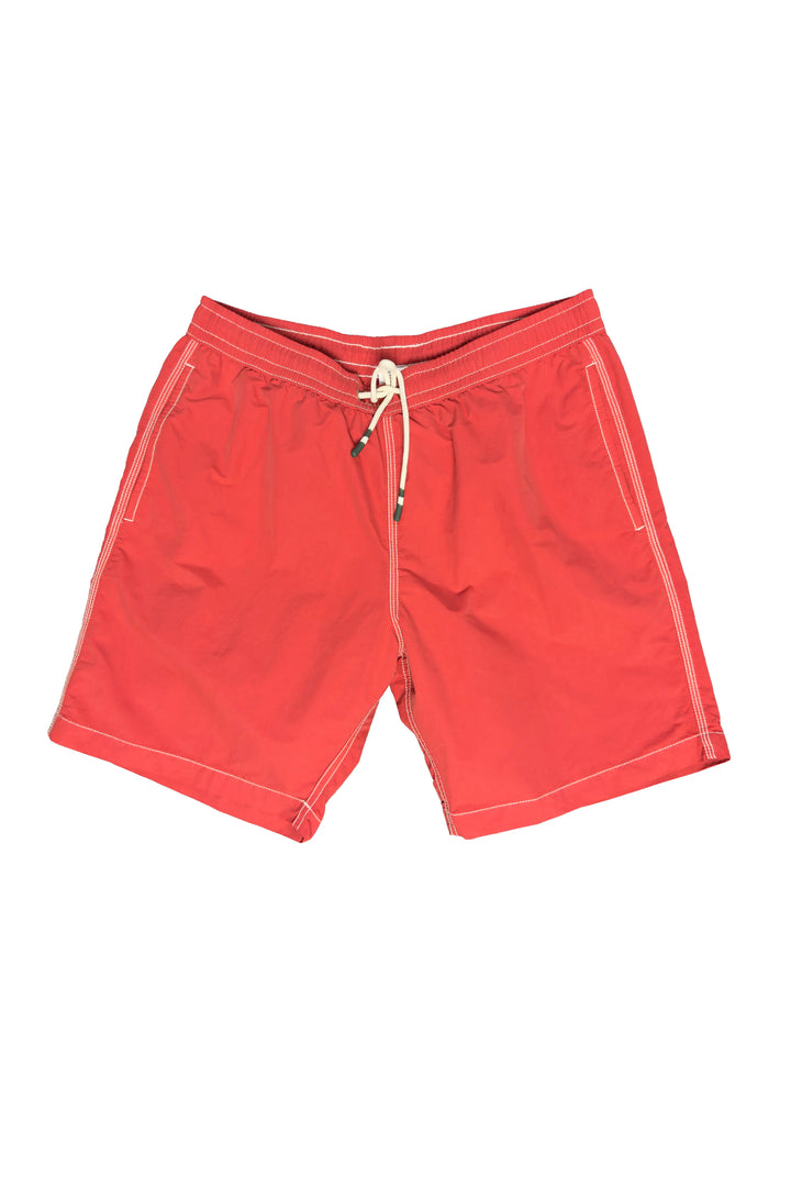 Red shorts with a white drawstring on a white background