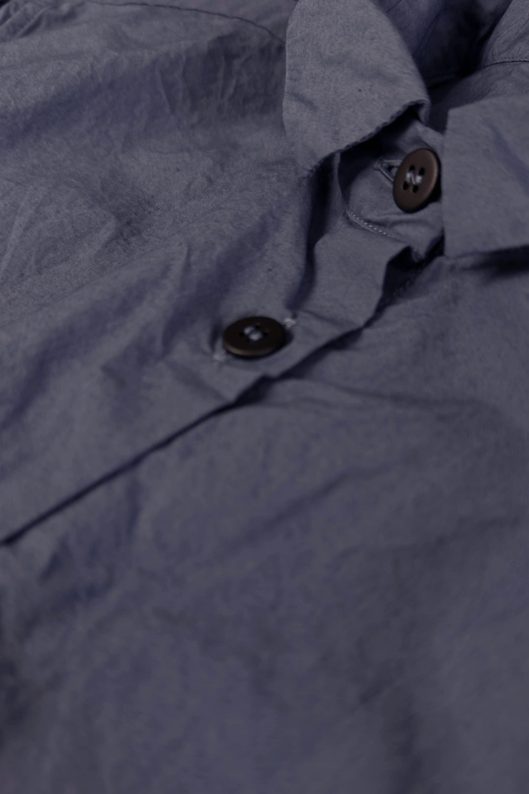 Close-up of a dark gray fabric with buttons