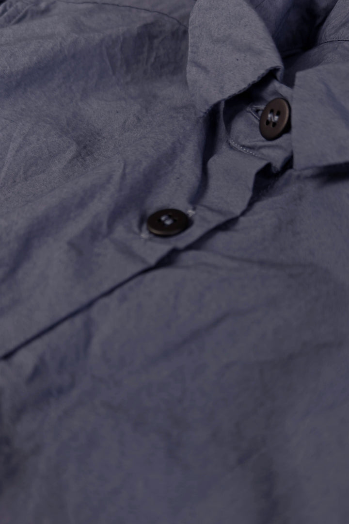 Close-up of a dark gray fabric with buttons