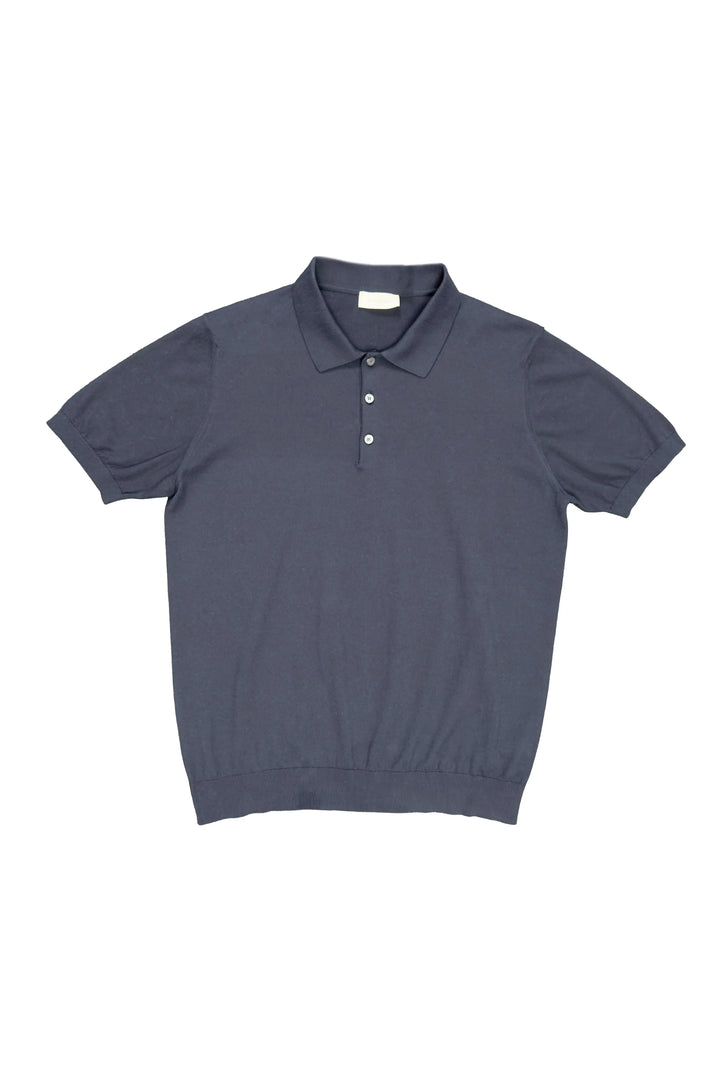 Dark blue polo shirt on a white background