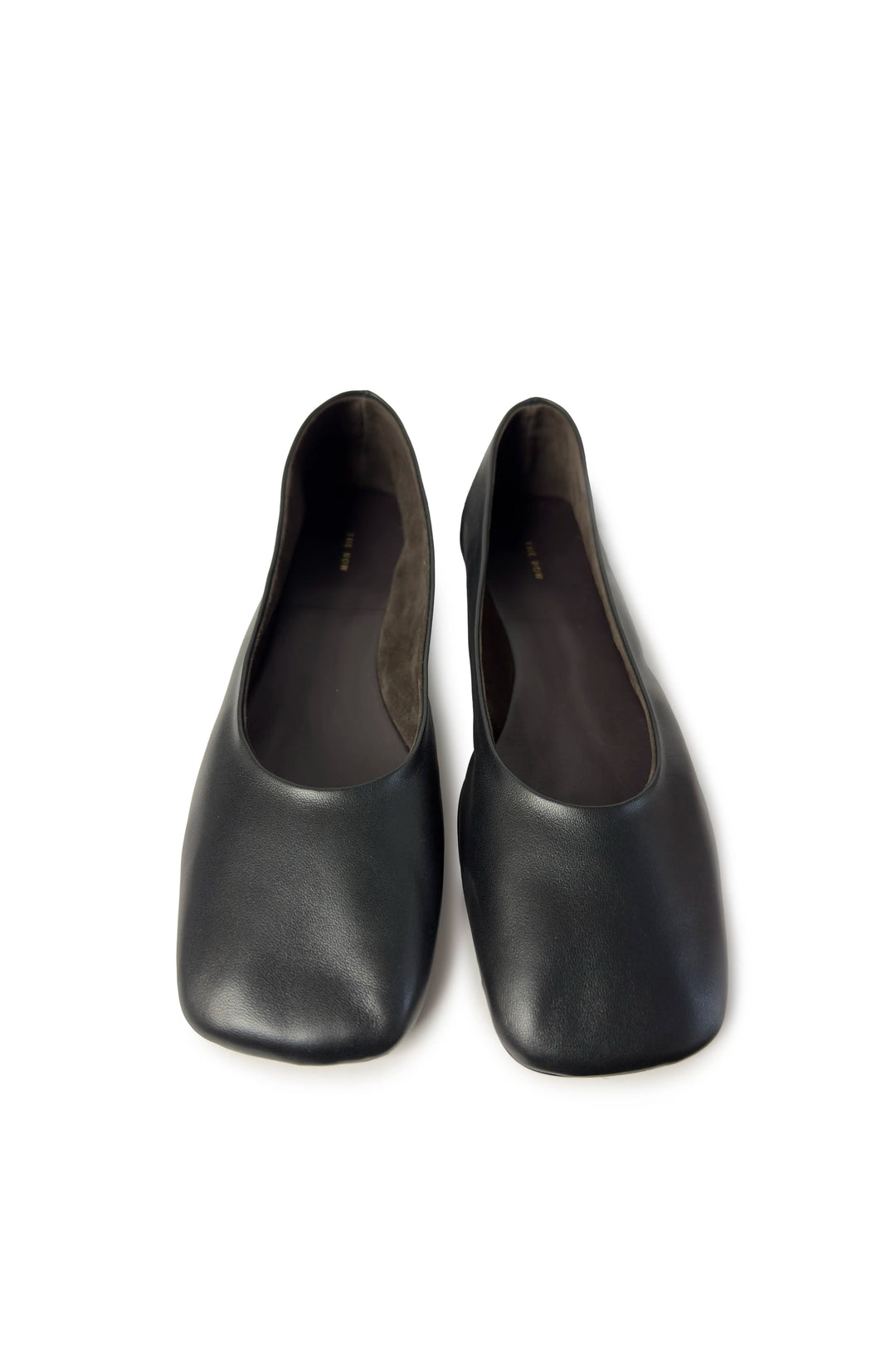 Pair of black high-heeled shoes on a white background