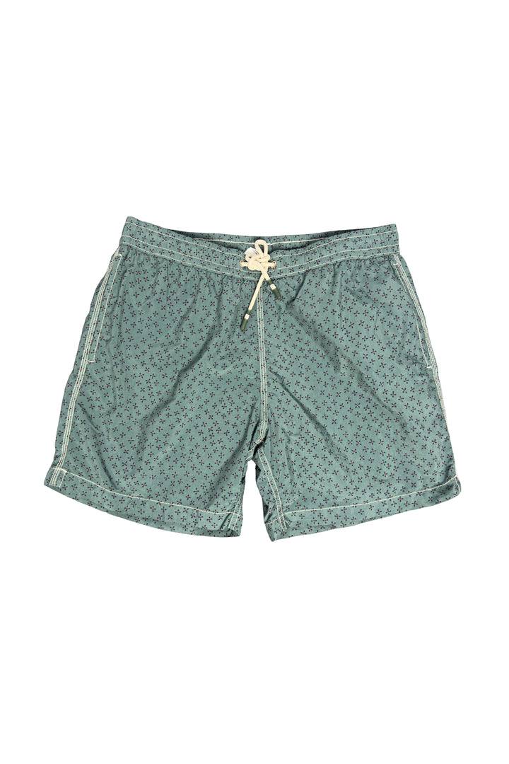 Green patterned shorts on a white background