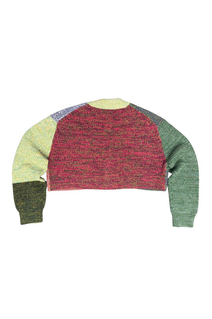 Color-blocked sweater with green, red, and beige sections on a white background