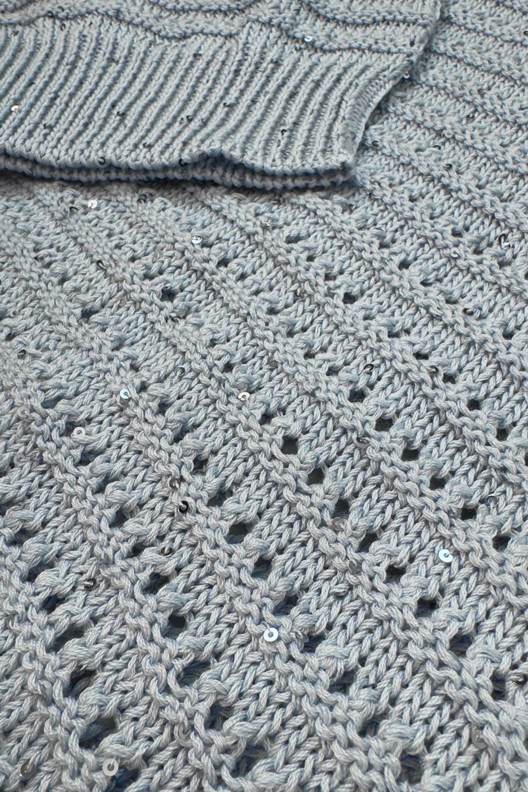 Close-up of a textured gray fabric with a pattern