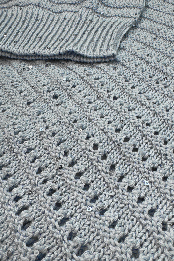 Close-up of a textured gray fabric with a pattern
