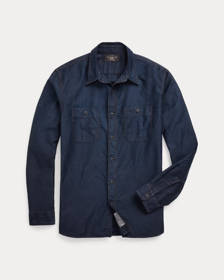 Navy blue denim shirt on a light gray background