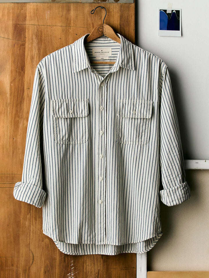 Striped shirt hanging on a wooden door