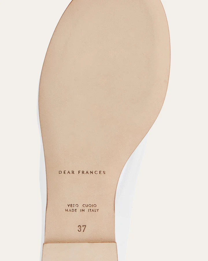 Close-up of a shoe insole with 'Dear Frances' branding and size 37 marking on a light background.